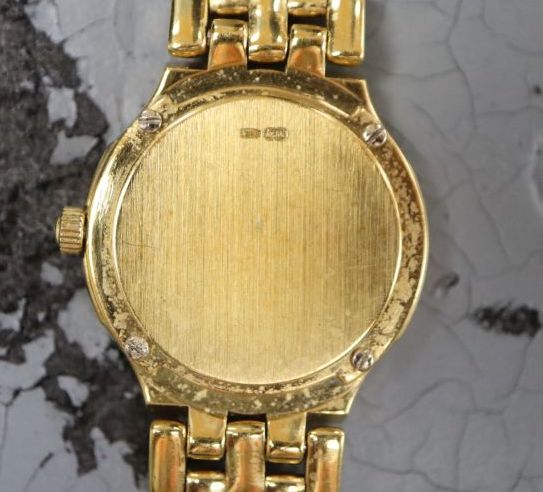 A ladys 1990s 18ct gold Omega quartz wrist watch on Omega 18ct gold bracelet,